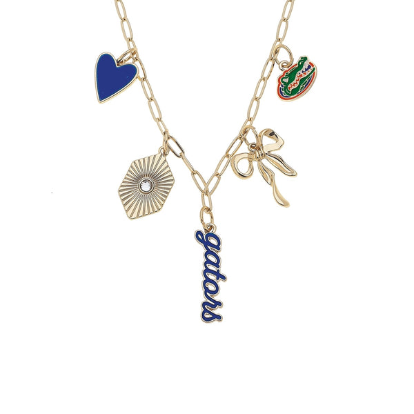 Necklace with various charms including a heart, alligator, and 'mom' pendant on a white background