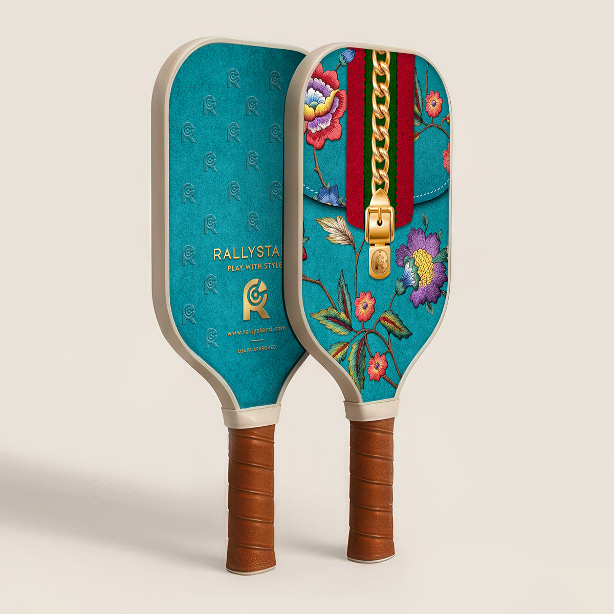 A pair of RallyStand luxury designer pickleball paddles showing both the front floral zipper design and the back monogram logo side against a white background.