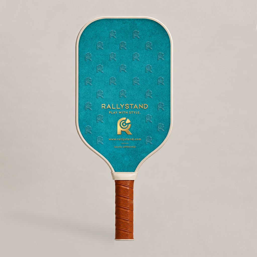 Back view face of Rally Stand performance pickleball paddle with teal monogram background pattern 